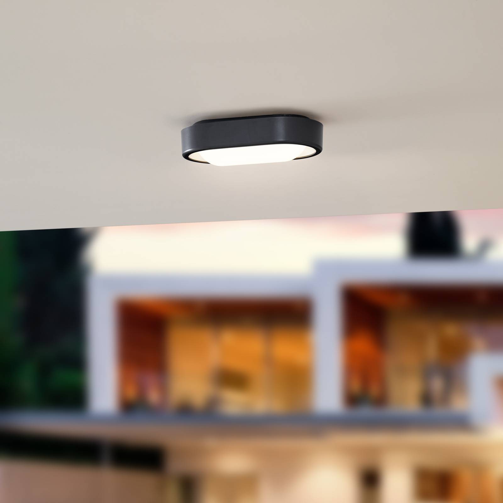 Lindby LED-Außenwandleuchte Niniel, schwarz/weiß, oval von LINDBY