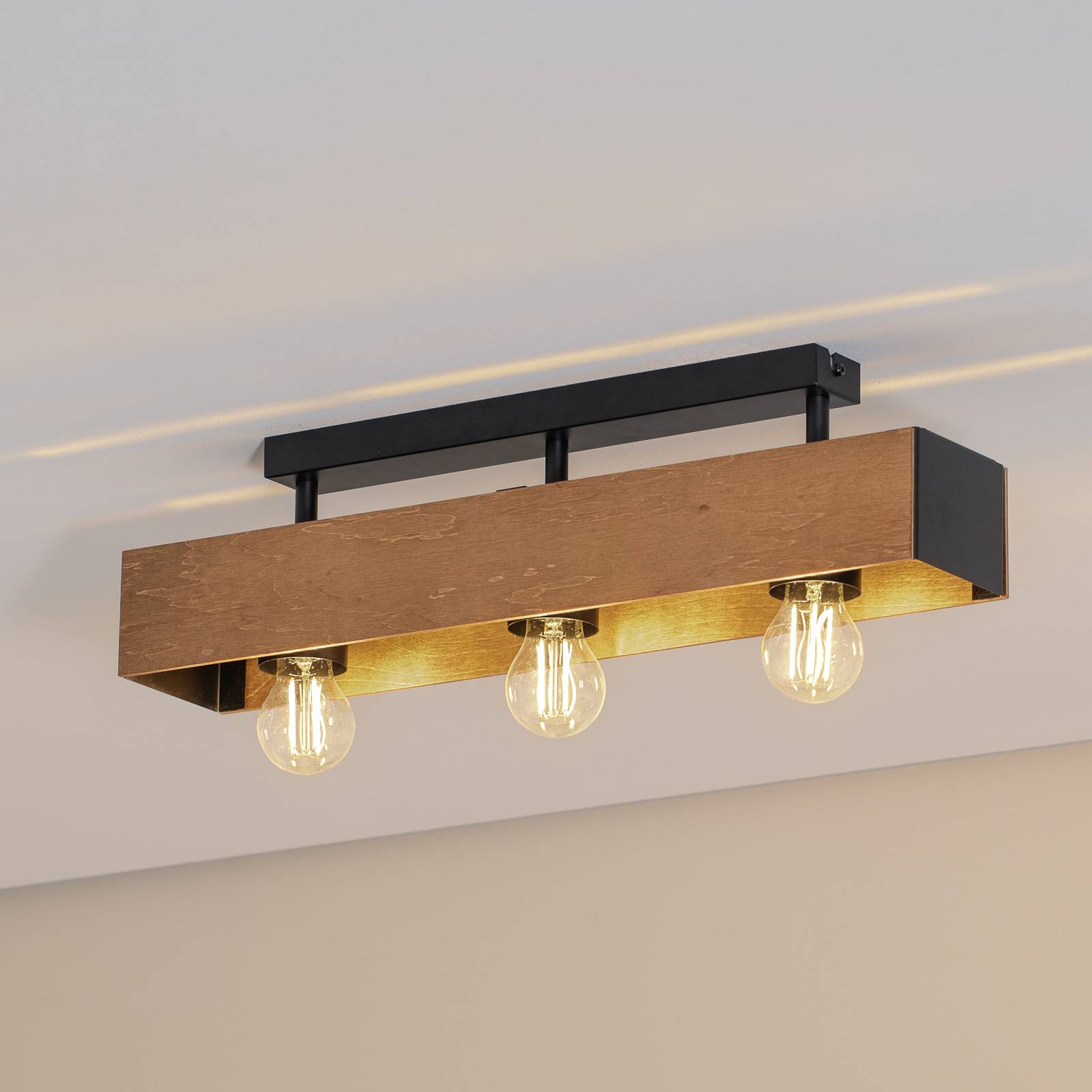 Deckenlampe Miluza, schwarz/braun, Länge 57 cm, Holz, 3-flg. Deckenlampe Miluza, schwarz/braun, Länge 57 cm, Holz, 3-flg. von Luminex